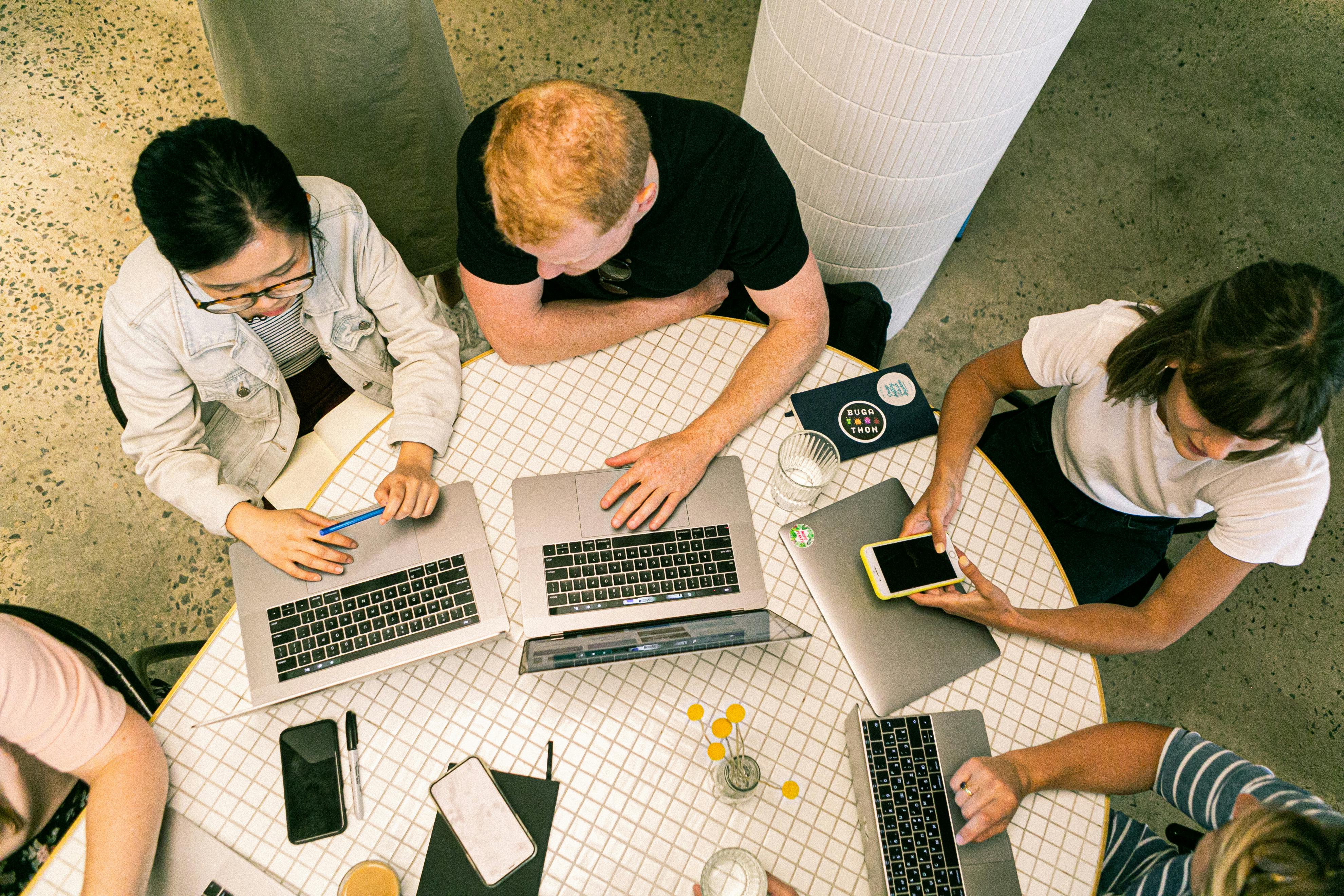Employees working on laptops.