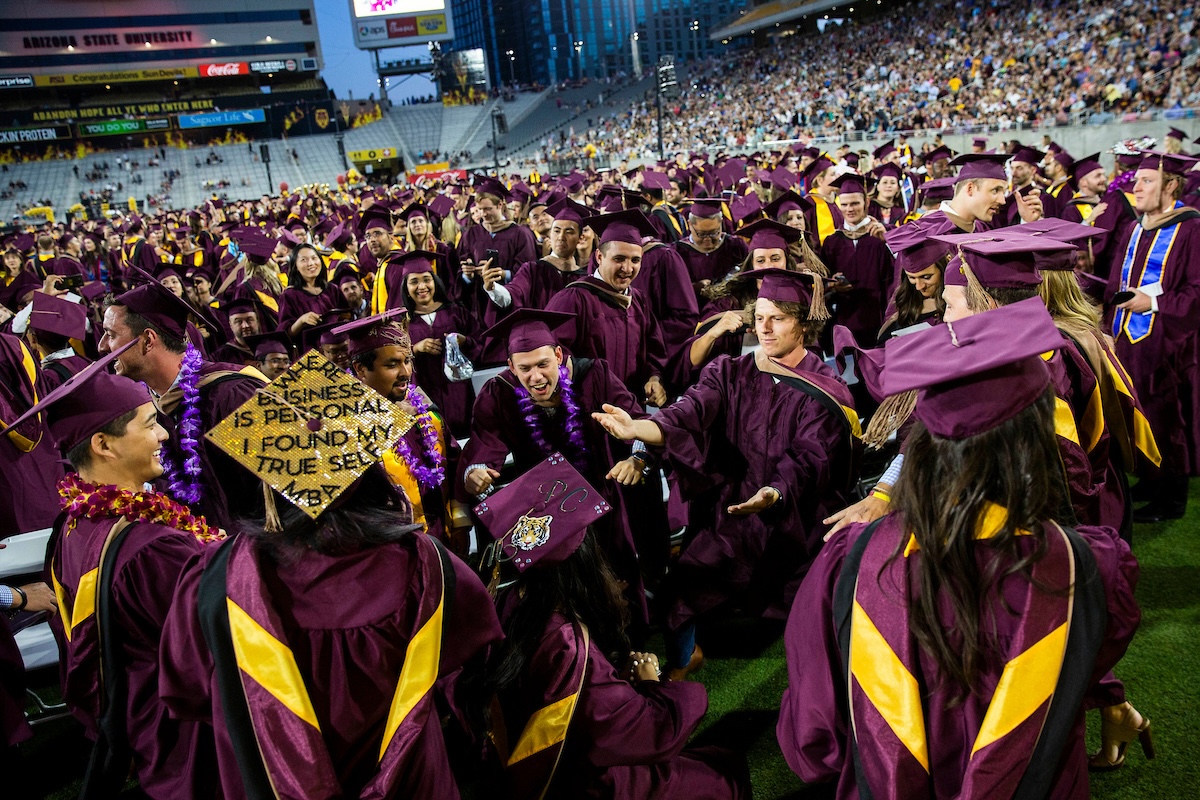 MBA graduates dancing